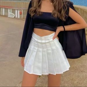 White pleaded skirt with built in shorts